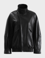 Women's black lambskin bomber jacket laid flat, front view, with a tall stand collar, snap placket and elastic hem