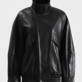 Women's black lambskin bomber jacket laid flat, front view, with a tall stand collar, snap placket and elastic hem