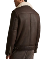 Back view of the men's brown shearling lined aviator jacket, showing the cream shearling collar and the buckled strap at the hem