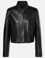 Women's black lambskin cropped jacket laid flat, front view, with a spread shirt collar, concealed placket and flap pockets
