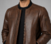 Men’s Alden cognac brown lambskin leather bomber jacket close view with black rib-knit collar, cuffs, hem and sleeve zip pocket