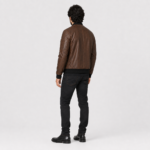 Men’s Alden cognac brown lambskin leather bomber jacket left side view with black rib-knit collar, cuffs, hem and sleeve zip pocket